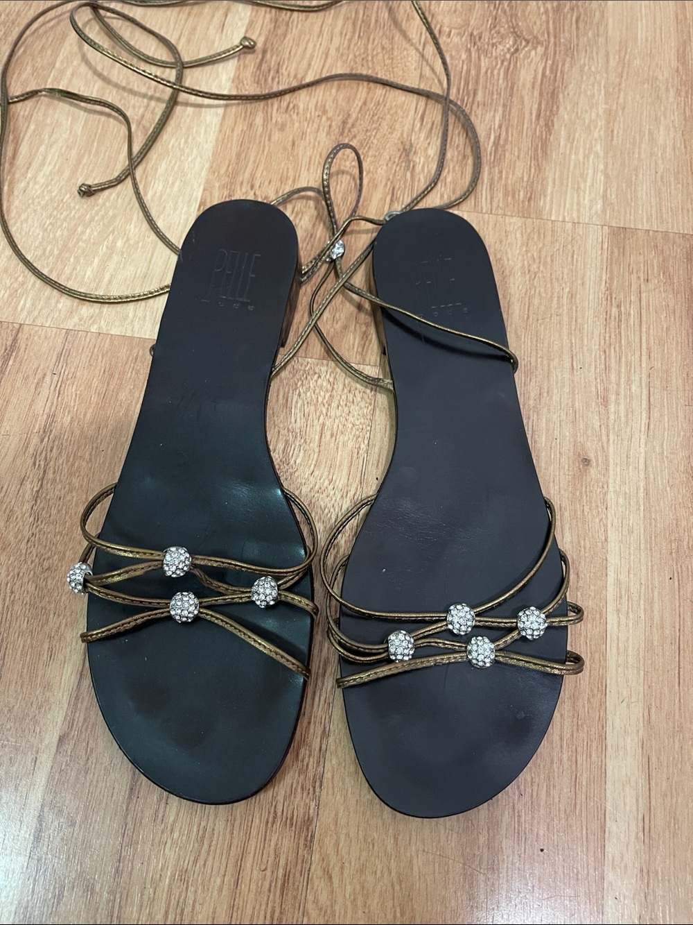 Pelle Moda Black Footbed Sandals with Gold Lace-Up Straps & Rhinestone Beads